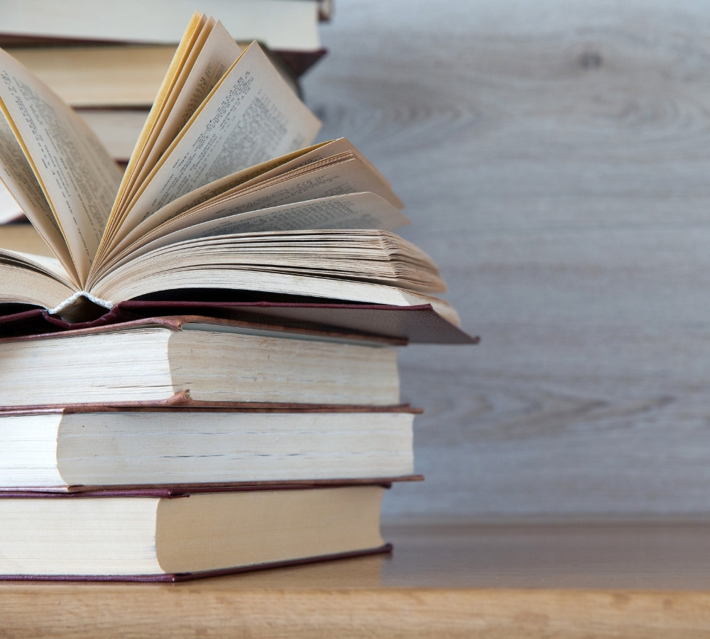 books on wooden deck tabletop