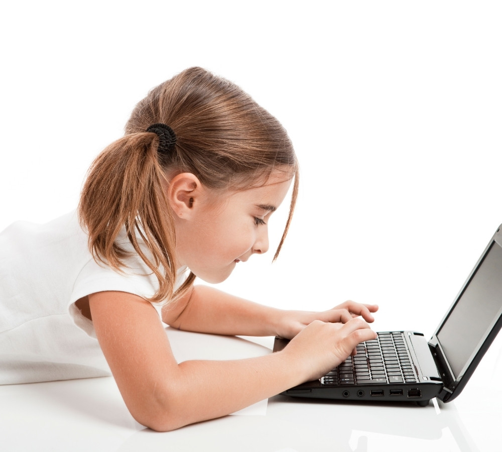 Little student girl with a laptop