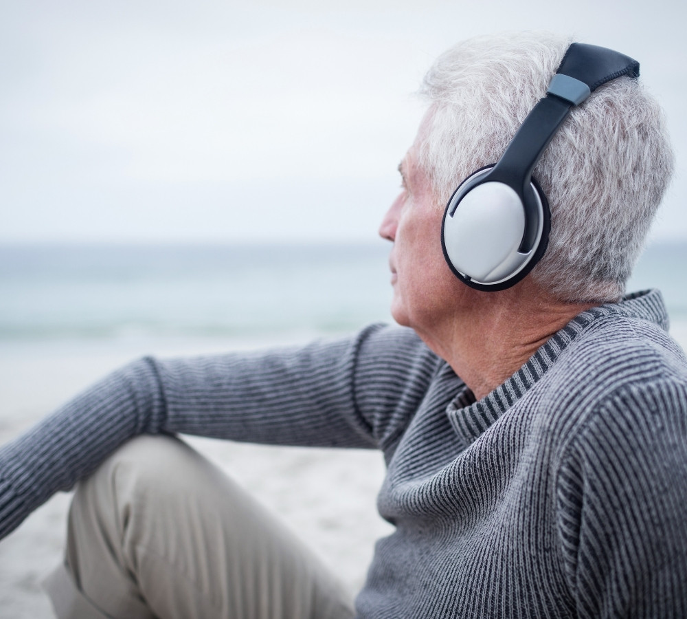 Senior man listening to music