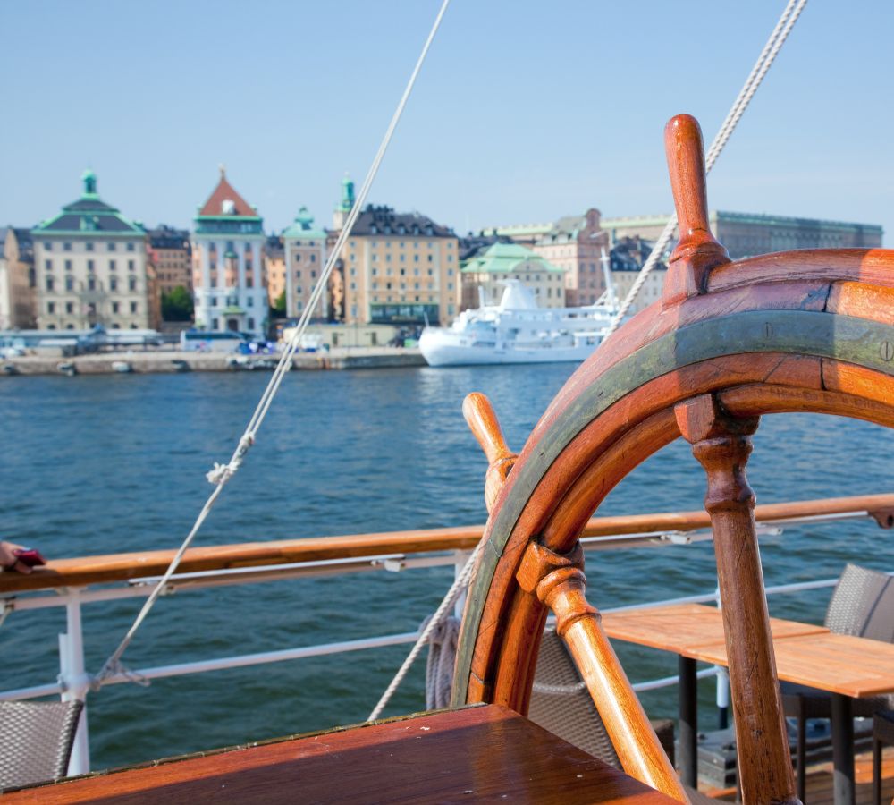 Ship helm and a view on Stockholm