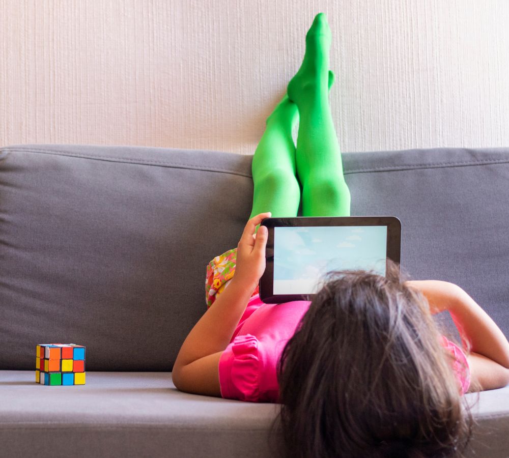 Little girl watching movie in tablet