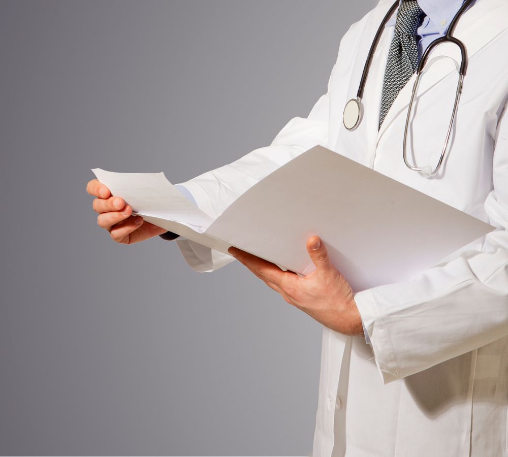 doctor reading clinic folder