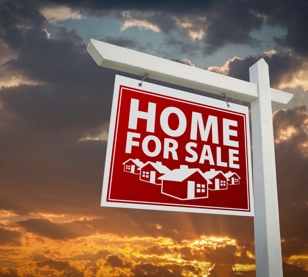 Home For Sale Real Estate Sign Over Sunset