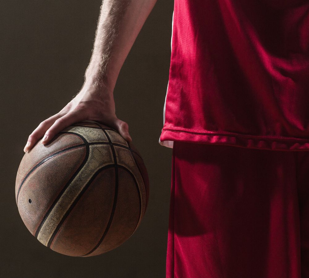 basketball held by basketball player
