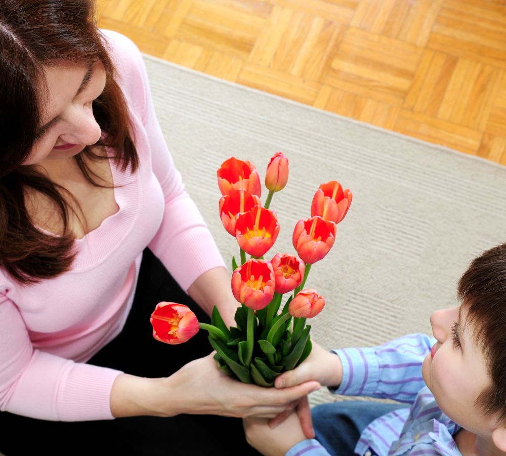 Mother and son with flowers