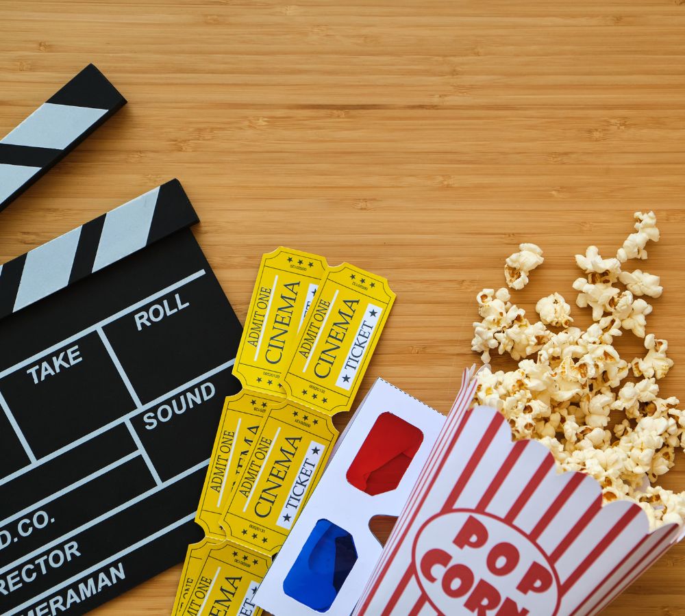 clapper board, movies tickets and popcorn