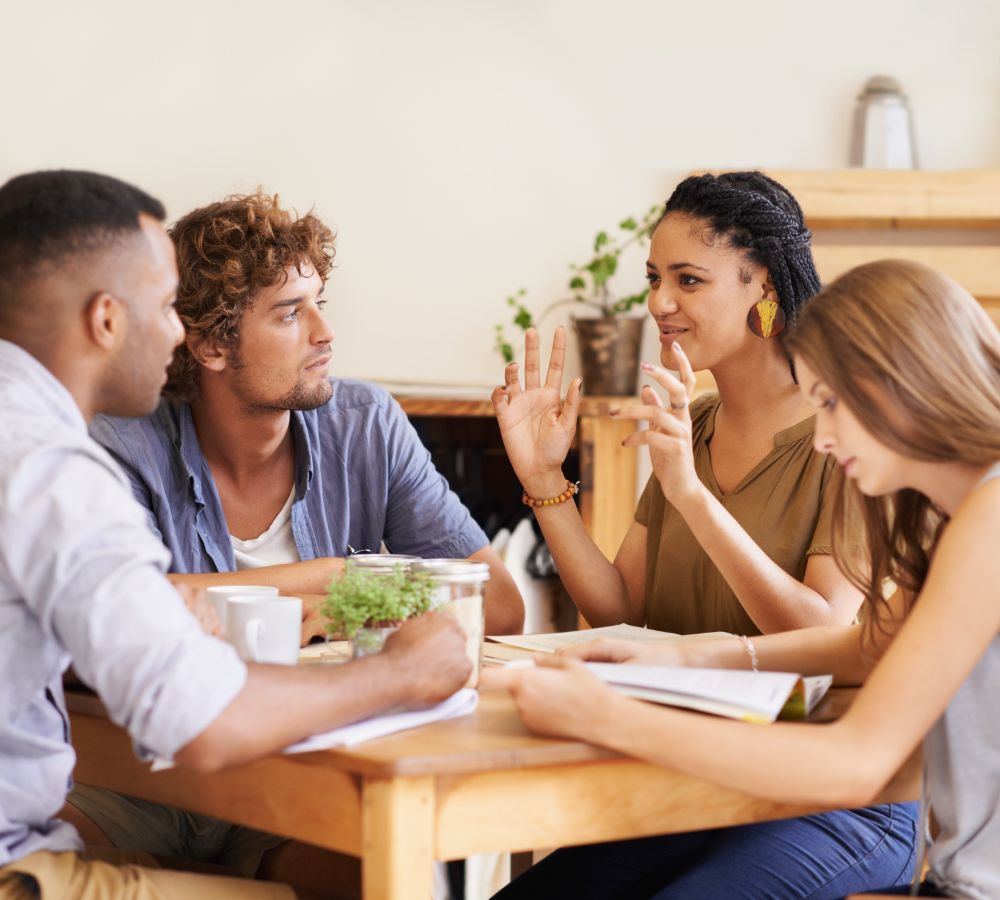 group of friends talking in a cafe